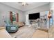 Cozy living area with grey walls, hardwood floors, and contemporary ceiling fan at 745 6Th Sw Ave, Hickory, NC 28602