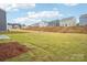 Vast backyard space showcasing the potential for outdoor activities and landscaping in this desirable neighborhood at 8059 Plymouth Dr, Sherrills Ford, NC 28673