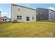 Spacious backyard with lush green grass and a charming home exterior, perfect for outdoor enjoyment and relaxation at 8059 Plymouth Dr, Sherrills Ford, NC 28673