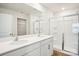 Modern bathroom with dual sinks, granite countertops, and glass-enclosed shower at 8059 Plymouth Dr, Sherrills Ford, NC 28673
