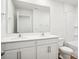 This gorgeous bathroom offers dual sinks, a large mirror and vanity, and a shower-tub combo at 8059 Plymouth Dr, Sherrills Ford, NC 28673