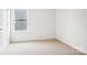 Well-lit bedroom featuring an off-white wall color and wall-to-wall carpeting at 8059 Plymouth Dr, Sherrills Ford, NC 28673