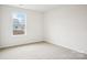 This bedroom is well-lit with wall-to-wall carpeting at 8059 Plymouth Dr, Sherrills Ford, NC 28673