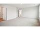 Spacious carpeted bedroom with doorways to bathroom, closets and hallway at 8059 Plymouth Dr, Sherrills Ford, NC 28673