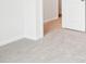 Carpeted bedroom showcasing a clean and bright interior, with doors leading to other rooms at 8059 Plymouth Dr, Sherrills Ford, NC 28673