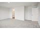 Bright, spacious bedroom featuring carpet flooring with an en suite bathroom at 8059 Plymouth Dr, Sherrills Ford, NC 28673