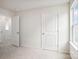 This bedroom features large windows, carpet, and large closets at 8059 Plymouth Dr, Sherrills Ford, NC 28673