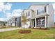Street view of newly built homes, showcasing consistent landscaping and attractive curb appeal at 8059 Plymouth Dr, Sherrills Ford, NC 28673