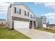Attractive home featuring stone accents, neutral siding, and an attached two-car garage at 8059 Plymouth Dr, Sherrills Ford, NC 28673