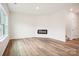 Spacious living room with luxury vinyl plank flooring, fireplace, and ample natural light at 8059 Plymouth Dr, Sherrills Ford, NC 28673