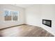 Bright living room featuring luxury vinyl plank flooring and a modern fireplace at 8059 Plymouth Dr, Sherrills Ford, NC 28673