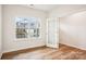 Bright living room with hardwood floors, large window, and glass door, showcasing an inviting space at 8059 Plymouth Dr, Sherrills Ford, NC 28673