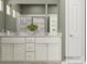 Bathroom featuring double sink vanity, framed mirrors, and neutral color palette at 8432 Norman Forest Rd, Lancaster, SC 29720