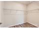 Walk-in closet featuring wood flooring, ample shelving and storage space at 8432 Norman Forest Rd, Lancaster, SC 29720