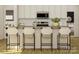 Modern kitchen featuring white cabinets, a stainless steel microwave, and a center island with bar stool seating at 8432 Norman Forest Rd, Lancaster, SC 29720