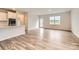 Bright open-concept living room showcasing wood flooring, natural light, and a view of the backyard at 8432 Norman Forest Rd, Lancaster, SC 29720