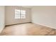 Bright bedroom with wood flooring, a large window, and neutral paint at 8442 Norman Forest Rd, Lancaster, SC 29720
