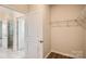 Walk-in closet featuring built in storage shelves and wood flooring at 8442 Norman Forest Rd, Lancaster, SC 29720