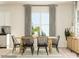 Dining area featuring a wooden table, modern chairs, and a view of the backyard at 8442 Norman Forest Rd, Lancaster, SC 29720