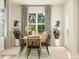 Dining room with large windows, elegant curtains, and a stylish dining set at 8442 Norman Forest Rd, Lancaster, SC 29720