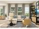Inviting living room with a comfortable white sofa, large windows, and stylish decor at 8442 Norman Forest Rd, Lancaster, SC 29720