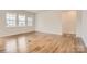 Bright and spacious living room featuring wood flooring, ample natural light, and neutral wall color at 8442 Norman Forest Rd, Lancaster, SC 29720