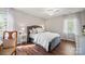 Charming bedroom with hardwood floors, a cozy bed, and soft lighting creates a warm, inviting atmosphere at 8707 Copenhagen Ln, Charlotte, NC 28216
