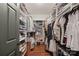 Spacious walk-in closet with custom shelving and ample storage for clothes and shoes at 8707 Copenhagen Ln, Charlotte, NC 28216