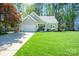 Charming single-story home with manicured lawn, two-car garage, and inviting front entrance at 8707 Copenhagen Ln, Charlotte, NC 28216