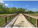 Picturesque greenway bridge featuring metal railing and concrete deck, perfect for scenic strolls and recreation at 8707 Copenhagen Ln, Charlotte, NC 28216