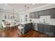 Modern kitchen boasts stainless appliances, white subway tile backsplash, and stylish pendant lighting at 8707 Copenhagen Ln, Charlotte, NC 28216