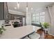 Modern kitchen with stainless steel appliances, quartz countertops, ample cabinet space, and hardwood flooring at 8707 Copenhagen Ln, Charlotte, NC 28216
