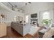 Bright, open living room with high ceilings, hardwood floors, fireplace, and a large, comfortable sofa at 8707 Copenhagen Ln, Charlotte, NC 28216