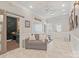 Living room featuring tile flooring, a comfortable couch, guitars mounted on the wall, and accent lights at 8707 Copenhagen Ln, Charlotte, NC 28216