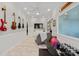 Bright living area boasts musical instruments on display, and exercise equipment, creating a versatile space at 8707 Copenhagen Ln, Charlotte, NC 28216