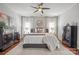 Serene bedroom with ceiling fan, neutral tones, plush carpet and two dressers for ample storage at 8707 Copenhagen Ln, Charlotte, NC 28216