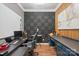 Inspiring home office with modern desk, soundproofing and hardwood floors is perfect for working from home at 8707 Copenhagen Ln, Charlotte, NC 28216