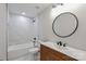Bathroom with modern vanity, sleek fixtures, and tiled walls at 8811 Steelechase Dr, Charlotte, NC 28273