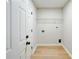 Laundry room with a wire shelf and washer and dryer hookups at 8811 Steelechase Dr, Charlotte, NC 28273