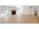 Inviting living room showcasing a modern fireplace, wood floors and windows providing lots of natural light at 8811 Steelechase Dr, Charlotte, NC 28273