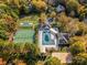 Aerial view of the tennis courts, pool, and volleyball court at 8929 Lizzie Ln, Huntersville, NC 28078
