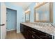 Bathroom features a dual sink vanity with granite countertops, modern fixtures, and great lighting at 8929 Lizzie Ln, Huntersville, NC 28078