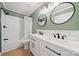 Bathroom with a double vanity, modern black fixtures, and a tiled shower/tub combination at 8929 Lizzie Ln, Huntersville, NC 28078