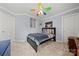 Bright bedroom features a ceiling fan, natural light, and colorful decor and ample storage at 8929 Lizzie Ln, Huntersville, NC 28078
