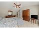 Comfortable bedroom with soft carpet, ceiling fan, with furniture and ample storage space at 8929 Lizzie Ln, Huntersville, NC 28078