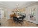 Bright dining area with tile floors, natural light, and a chandelier at 8929 Lizzie Ln, Huntersville, NC 28078