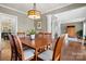 Dining room with hardwood floors, decorative columns, and views into other living spaces at 8929 Lizzie Ln, Huntersville, NC 28078