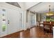 Bright foyer with hardwood floors, large windows, and adjacent formal dining area at 8929 Lizzie Ln, Huntersville, NC 28078