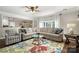 Cozy living room with a large sectional sofa and an accent rug at 8929 Lizzie Ln, Huntersville, NC 28078