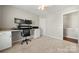 Home office features neutral carpeting, large windows and built-in desk at 8929 Lizzie Ln, Huntersville, NC 28078